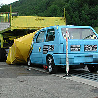 Lightweight car after impact test against a TMA on the rear of a lorry