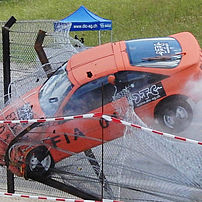Sports car colliding with a Formula 1 spectator safety fence at 150 km/h, a height of 2 m and an angle of 20°